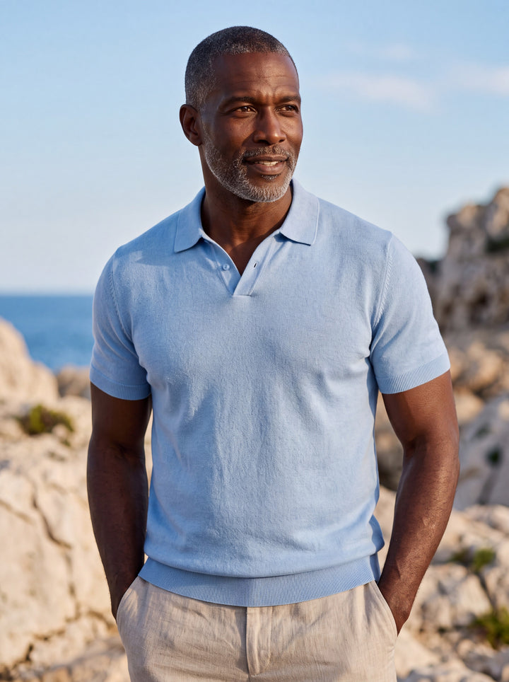 Donald Men polo shirt in blue, worn by a model on a Mediterranean terrace - Gentlemens Manor lifestyle