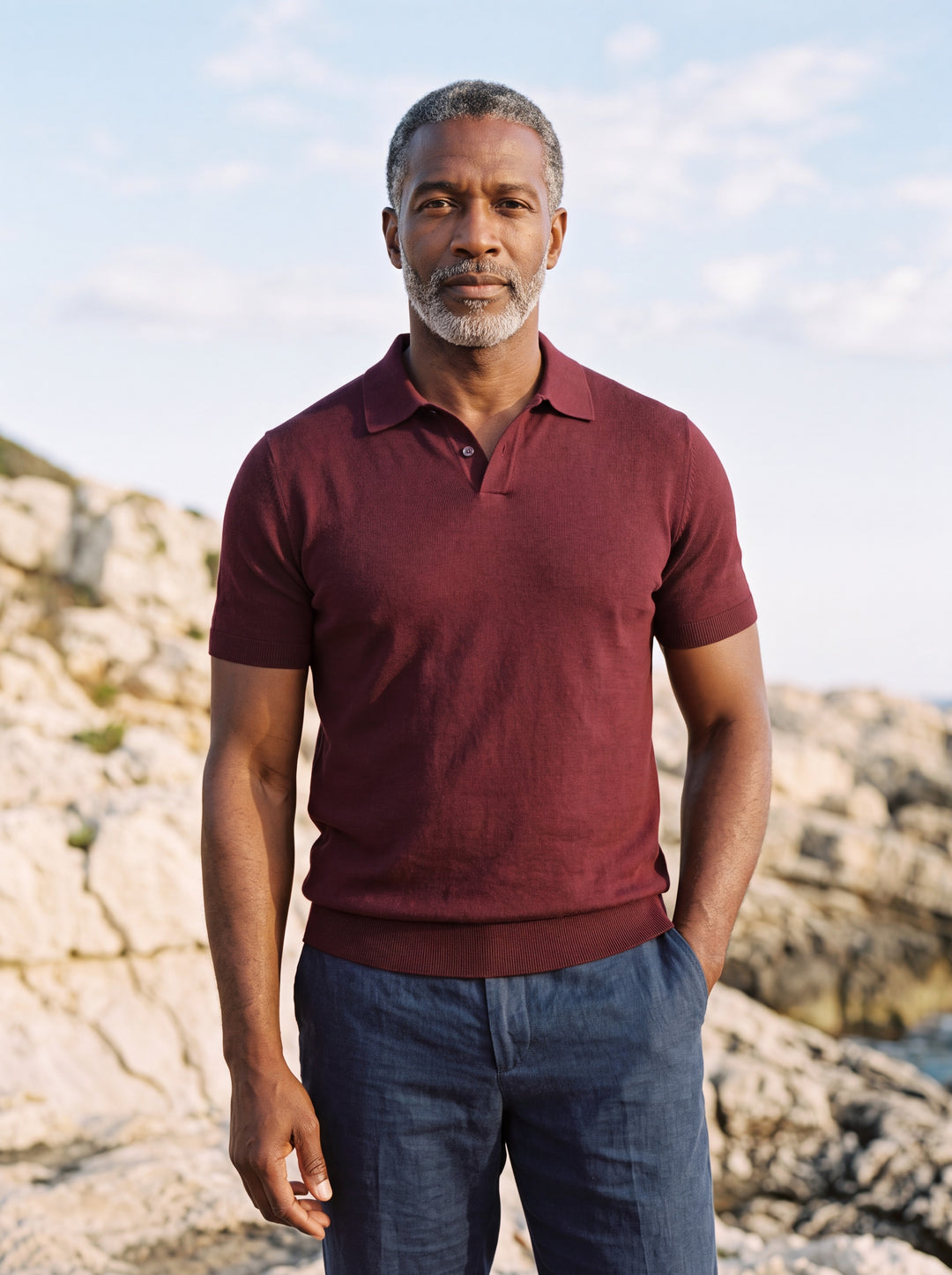Donald Men polo shirt in Burgundy, worn by a model on a Mediterranean terrace - Gentlemens Manor lifestyle