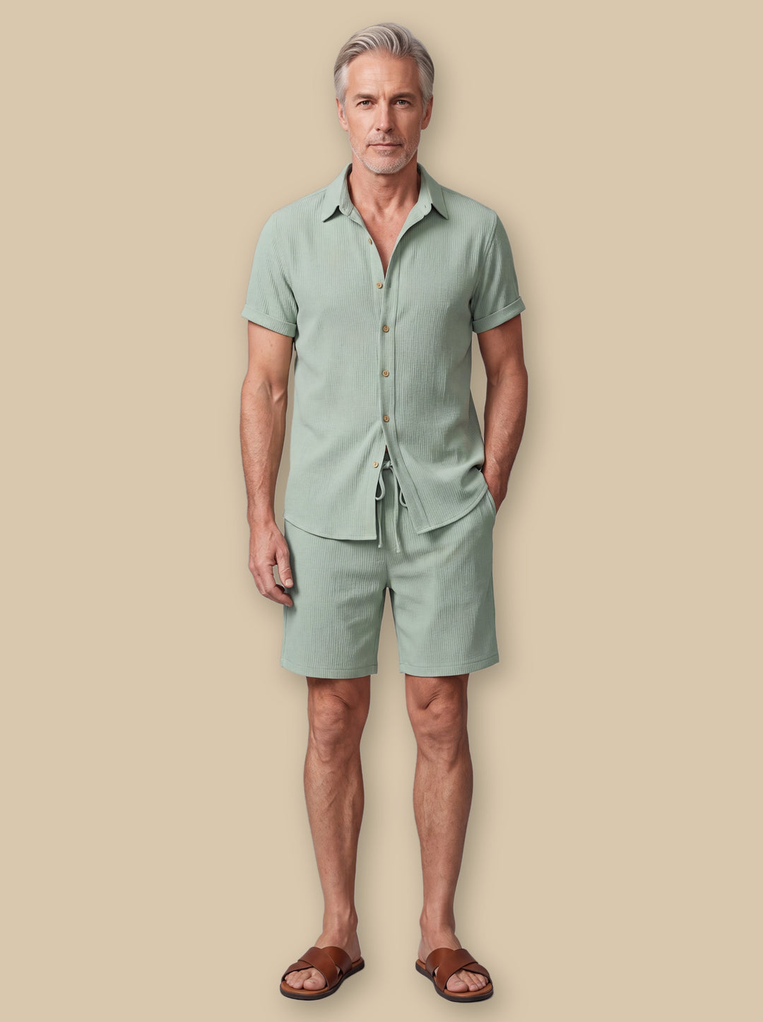 Donovan shirt and shorts set in Green, worn by a model on a warm sand studio background - Gentlemens Manor