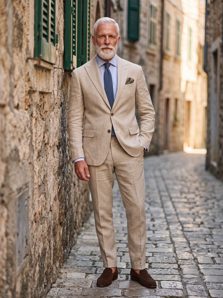 Douglas Men two-piece suit in beige, worn by a model in a Mediterranean setting - Gentlemens Manor lifestyle