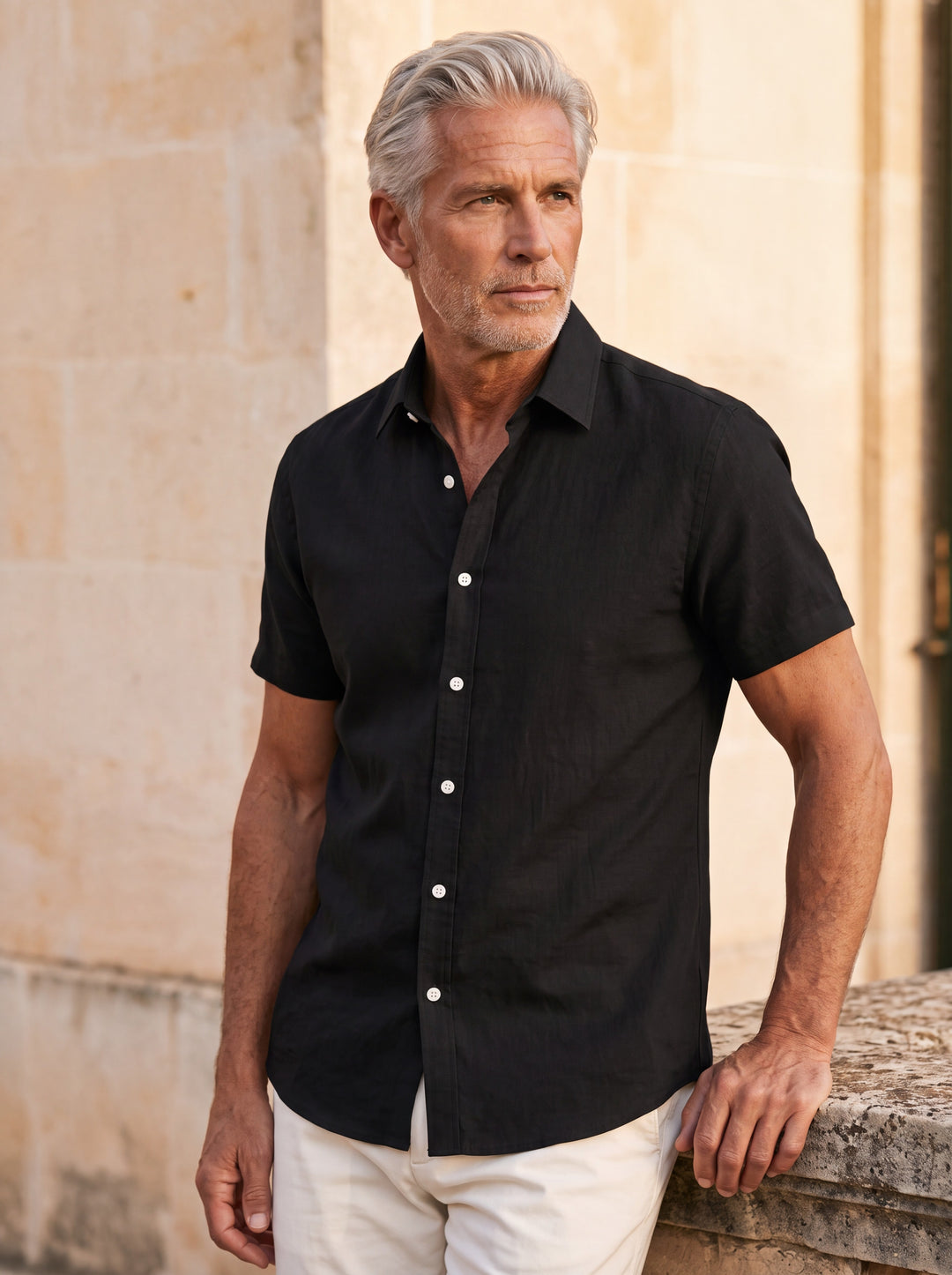 Douglas shirt in Black, worn by a model in a Mediterranean setting - Gentlemens Manor lifestyle