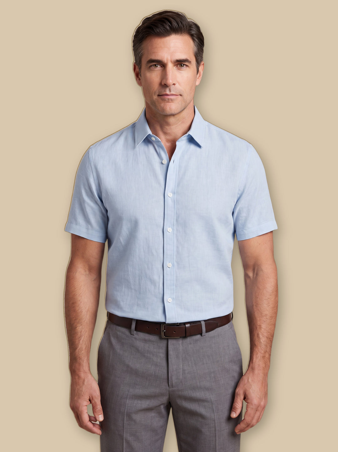 Douglas dress shirt in Blue, worn by a model on a warm sand studio background - Gentlemens Manor