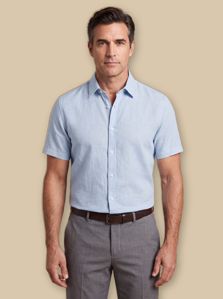 Douglas dress shirt in Blue, worn by a model on a warm sand studio background - Gentlemens Manor