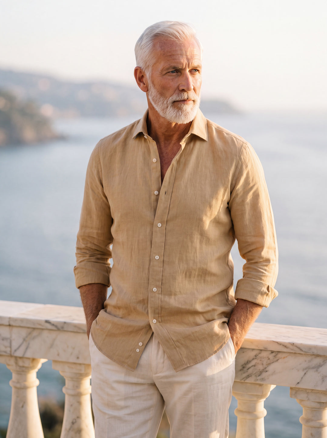 Doyle Men dress shirt in beige, worn by a model on a Mediterranean terrace - Gentlemens Manor lifestyle