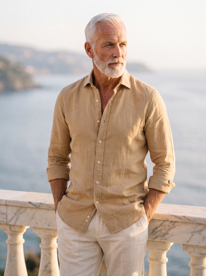 Doyle Men dress shirt in beige, worn by a model on a Mediterranean terrace - Gentlemens Manor lifestyle