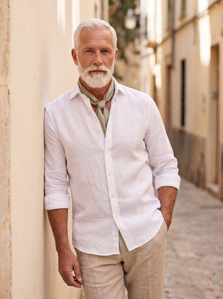 Doyle Men dress shirt in white, worn by a model on a Mediterranean terrace - Gentlemens Manor lifestyle