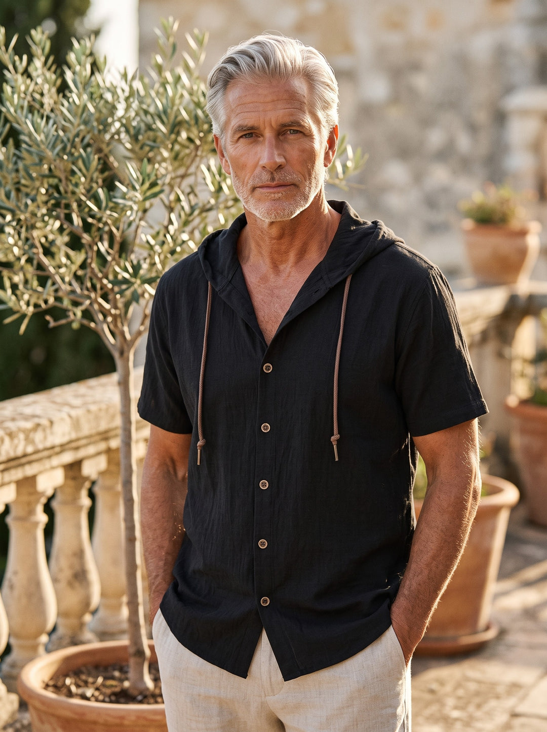 Drake Men hooded top in black, worn by a model on a Mediterranean terrace - Gentlemens Manor lifestyle