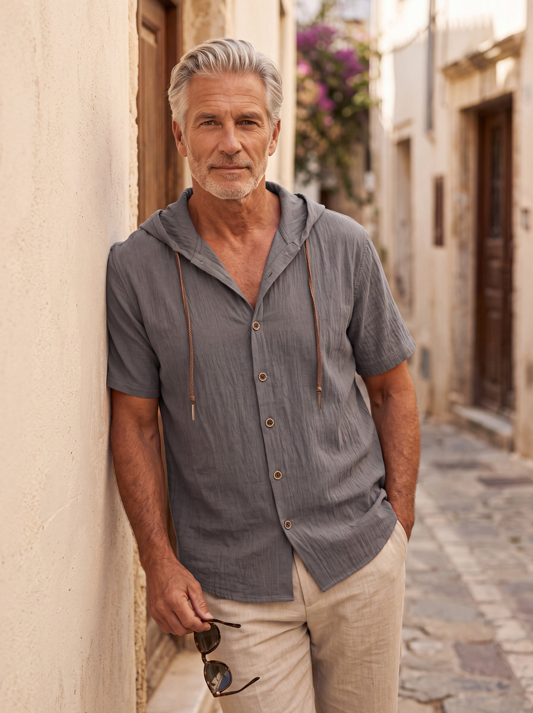 Drake Men hooded top in Grey, worn by a model on a Mediterranean terrace - Gentlemens Manor lifestyle