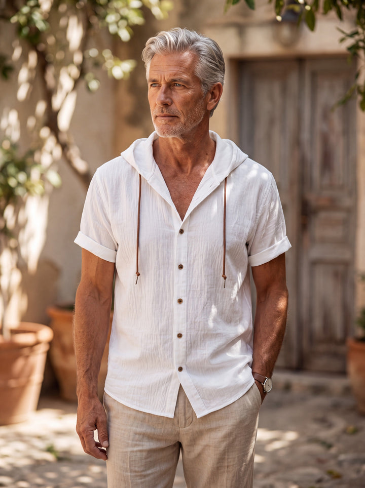 Drake Men hooded top in white, worn by a model on a Mediterranean terrace - Gentlemens Manor lifestyle