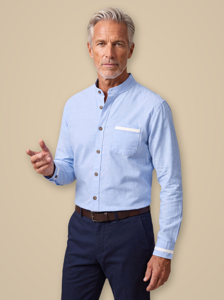 Edgar dress shirt in Light Blue, worn by a model on a warm taupe studio background - Gentlemens Manor