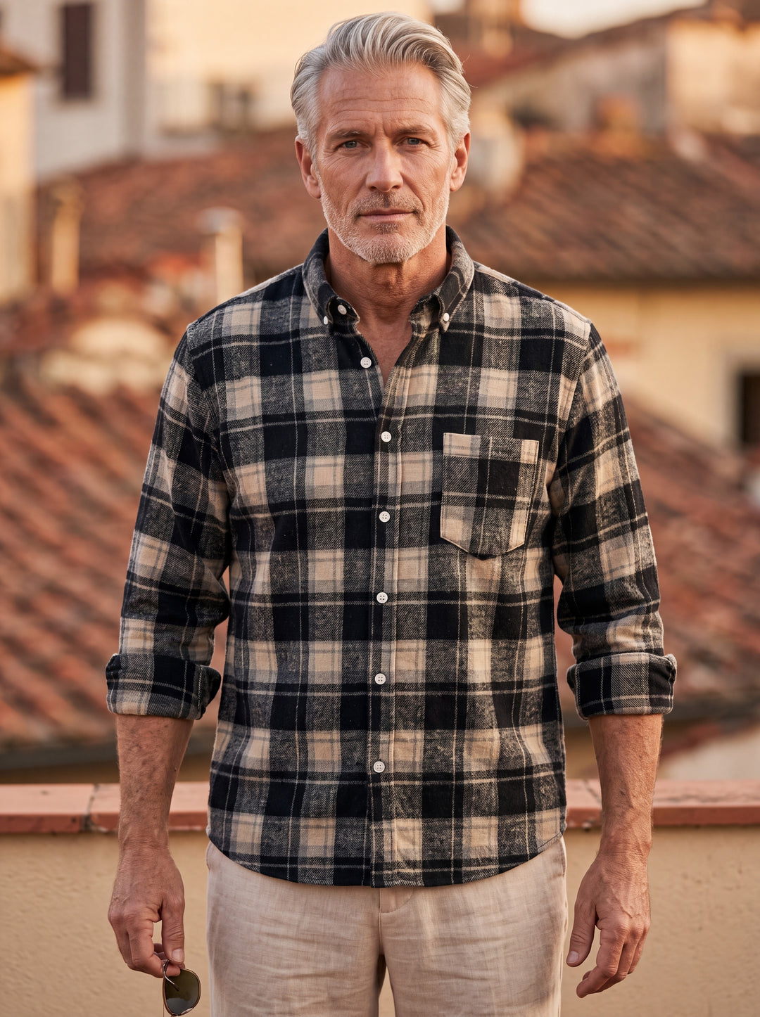 Edmund shirt in Black, worn by a model in a Mediterranean setting - Gentlemens Manor lifestyle