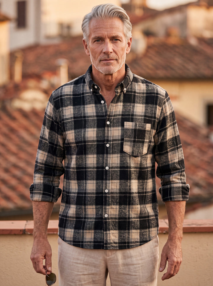 Edmund shirt in Black, worn by a model in a Mediterranean setting - Gentlemens Manor lifestyle