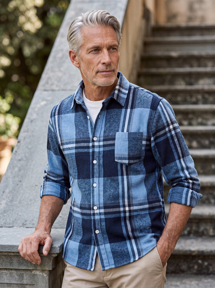 Edmund shirt in Blue, worn by a model in a Mediterranean setting - Gentlemens Manor lifestyle