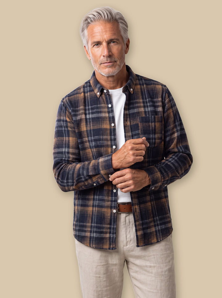 Edmund casual shirt in Navy, worn by a model on a warm sand studio background - Gentlemens Manor