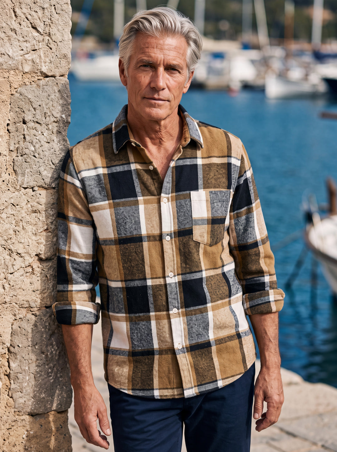 Edmund shirt in Sand, worn by a model in a Mediterranean setting - Gentlemens Manor lifestyle