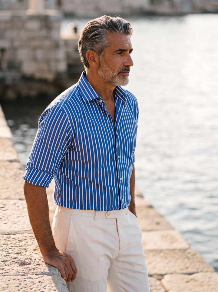 Edwin shirt in Blue, worn by a model in a Mediterranean setting - Gentlemens Manor lifestyle