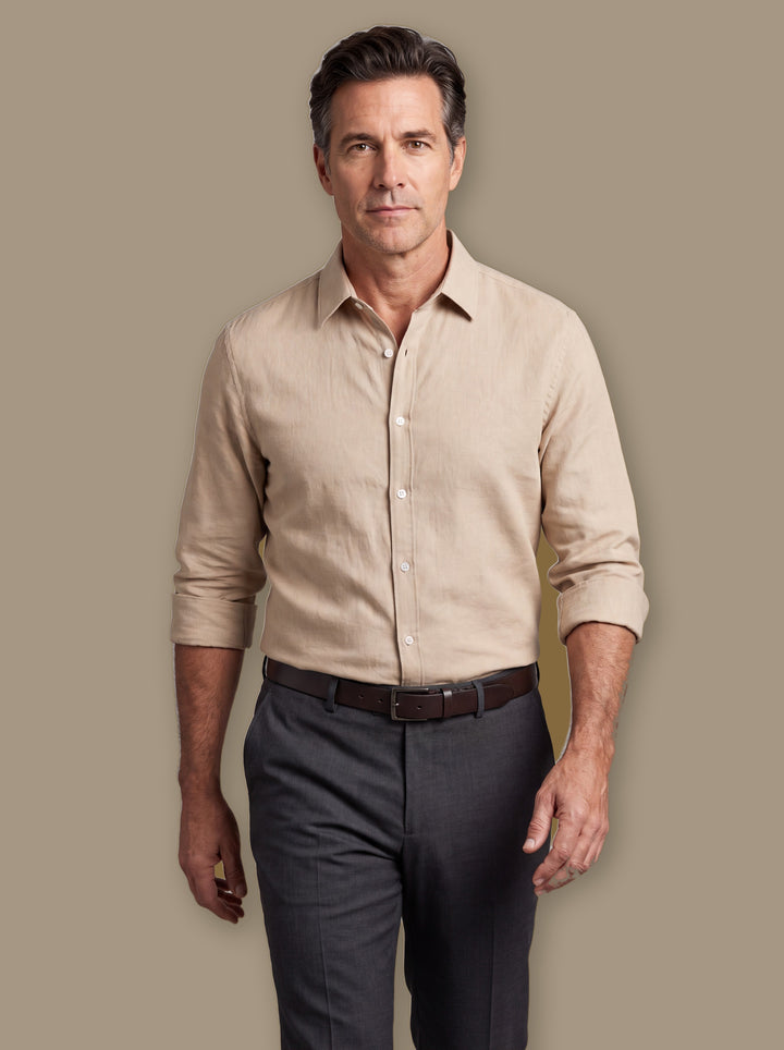Elias dress shirt in Sand, worn by a model on a warm taupe studio background - Gentlemens Manor