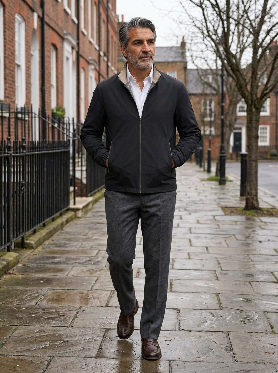 Elliot lightweight stand collar jacket in Black, lifestyle on a street of brick row houses, Gentlemens Manor