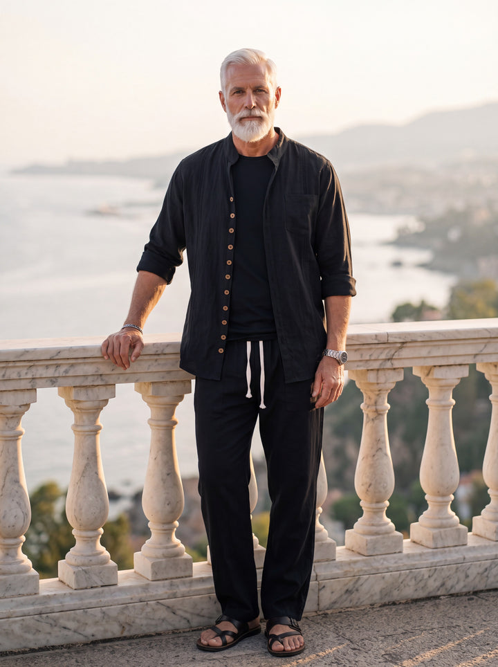 Elmer Men two piece set in black, worn by a model on a Mediterranean terrace - Gentlemens Manor lifestyle