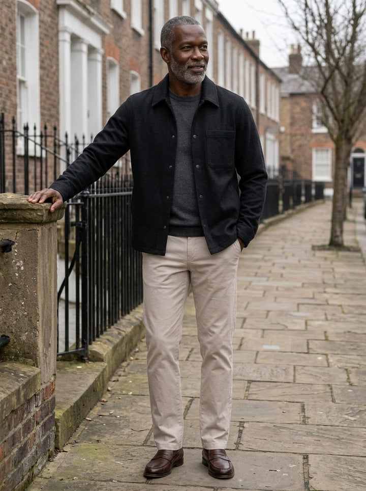 Elmore brushed snap front overshirt in Black, lifestyle on a street of brick row houses, Gentlemens Manor