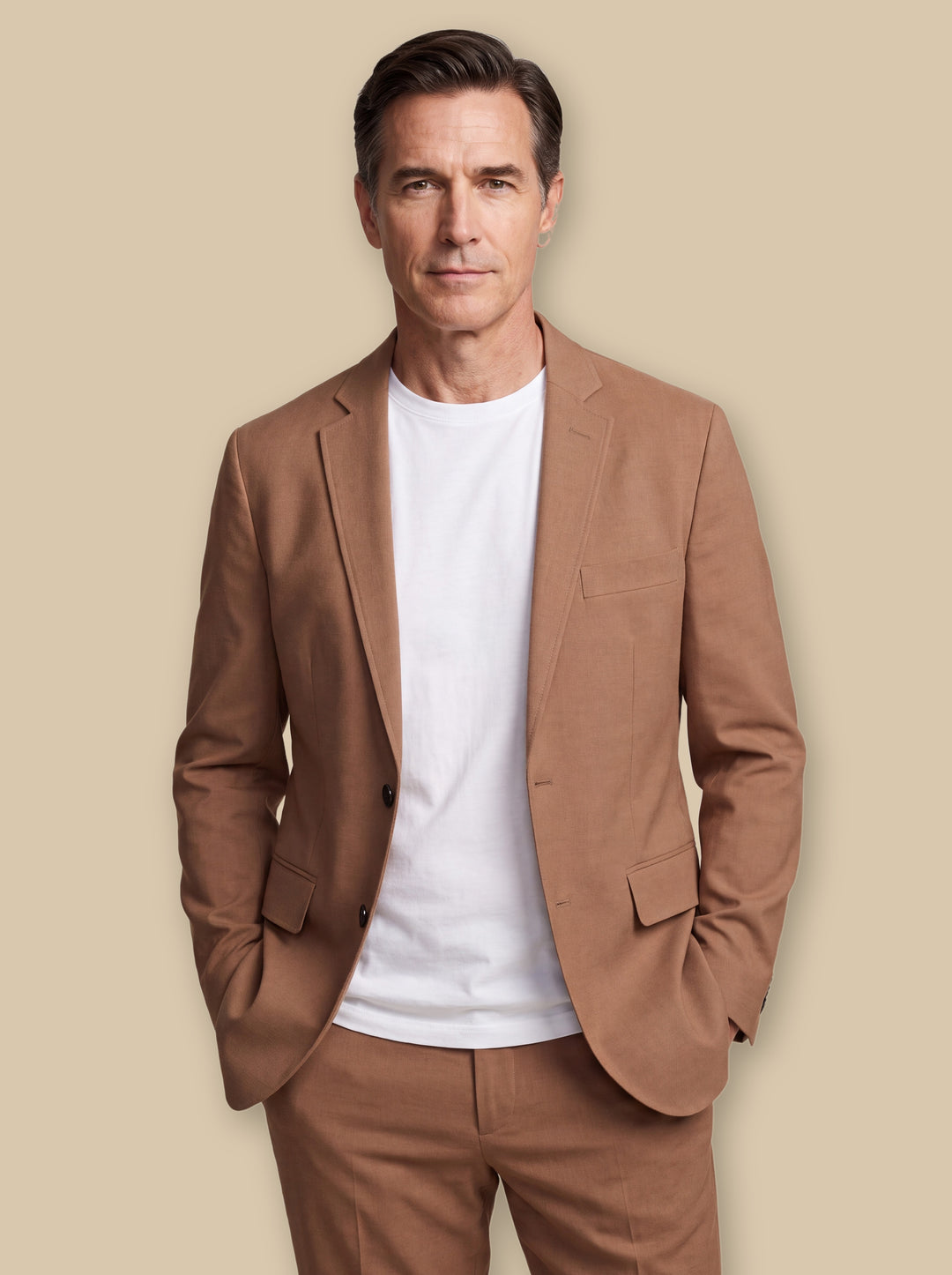 Elwood blazer suit in Brown, worn by a model on a warm sand studio background - Gentlemens Manor
