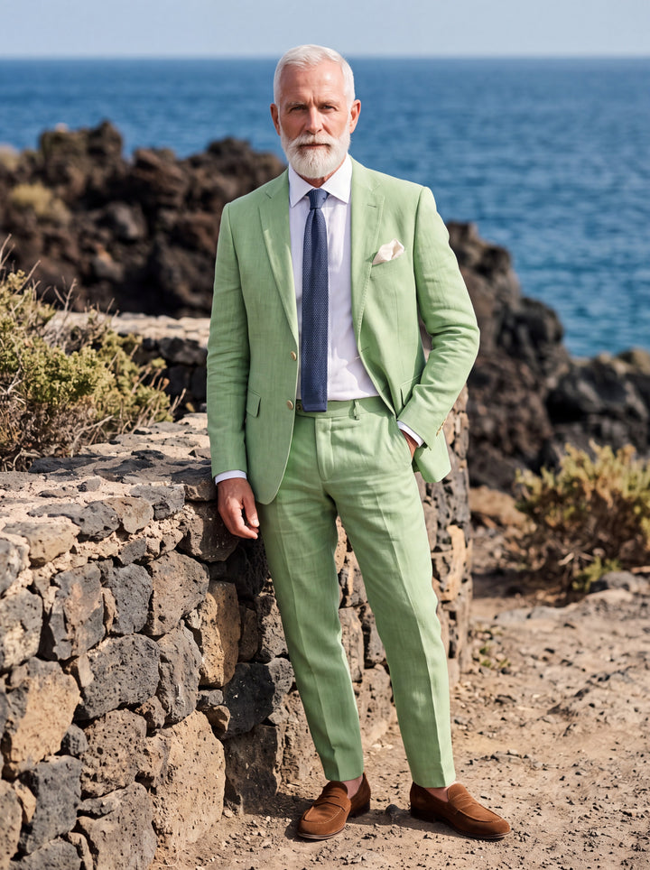 Emery Men two-piece suit in green, worn by a model in a Mediterranean setting - Gentlemens Manor lifestyle