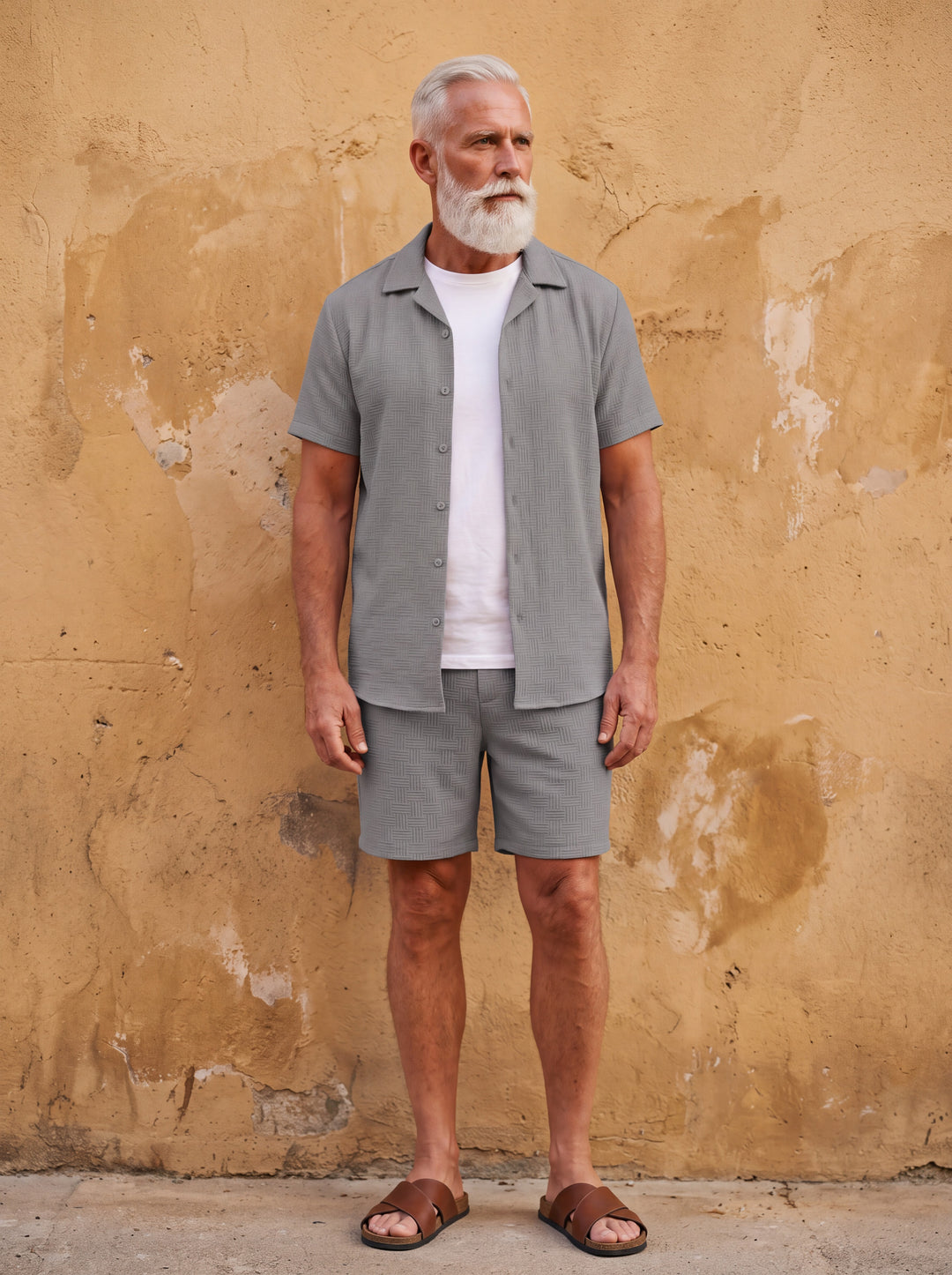 Emmett Men two-piece summer set in grey, worn by a model in a Mediterranean setting - Gentlemens Manor lifestyle