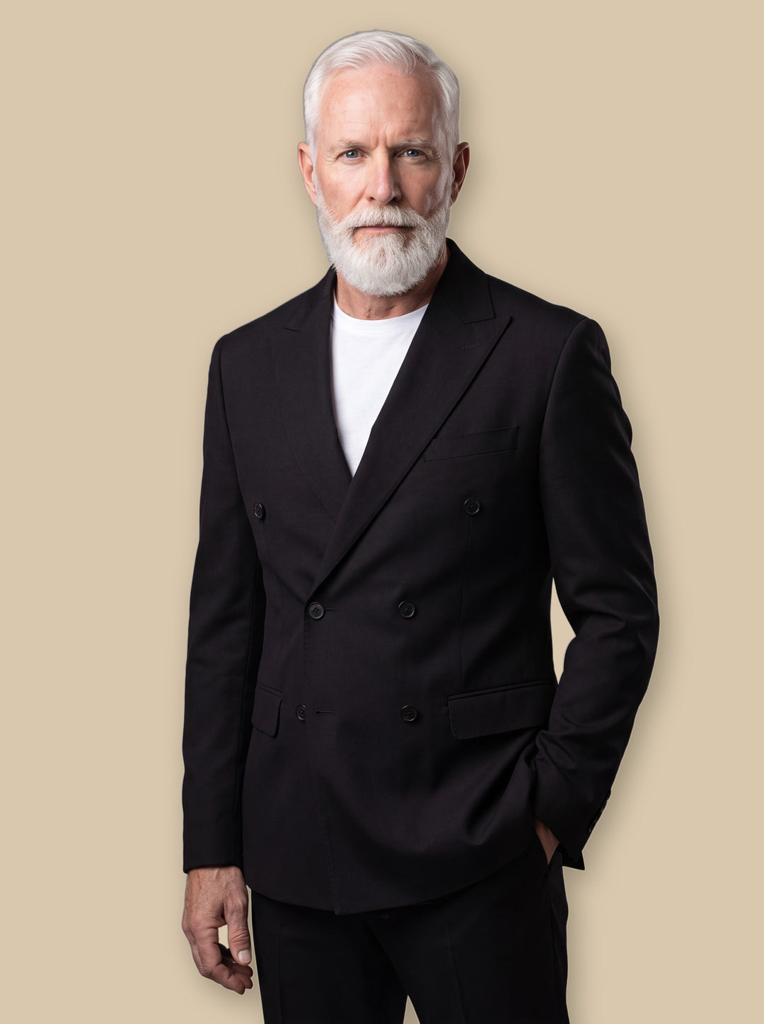 Ephraim blazer suit in Black, worn by a model on a warm sand studio background - Gentlemens Manor