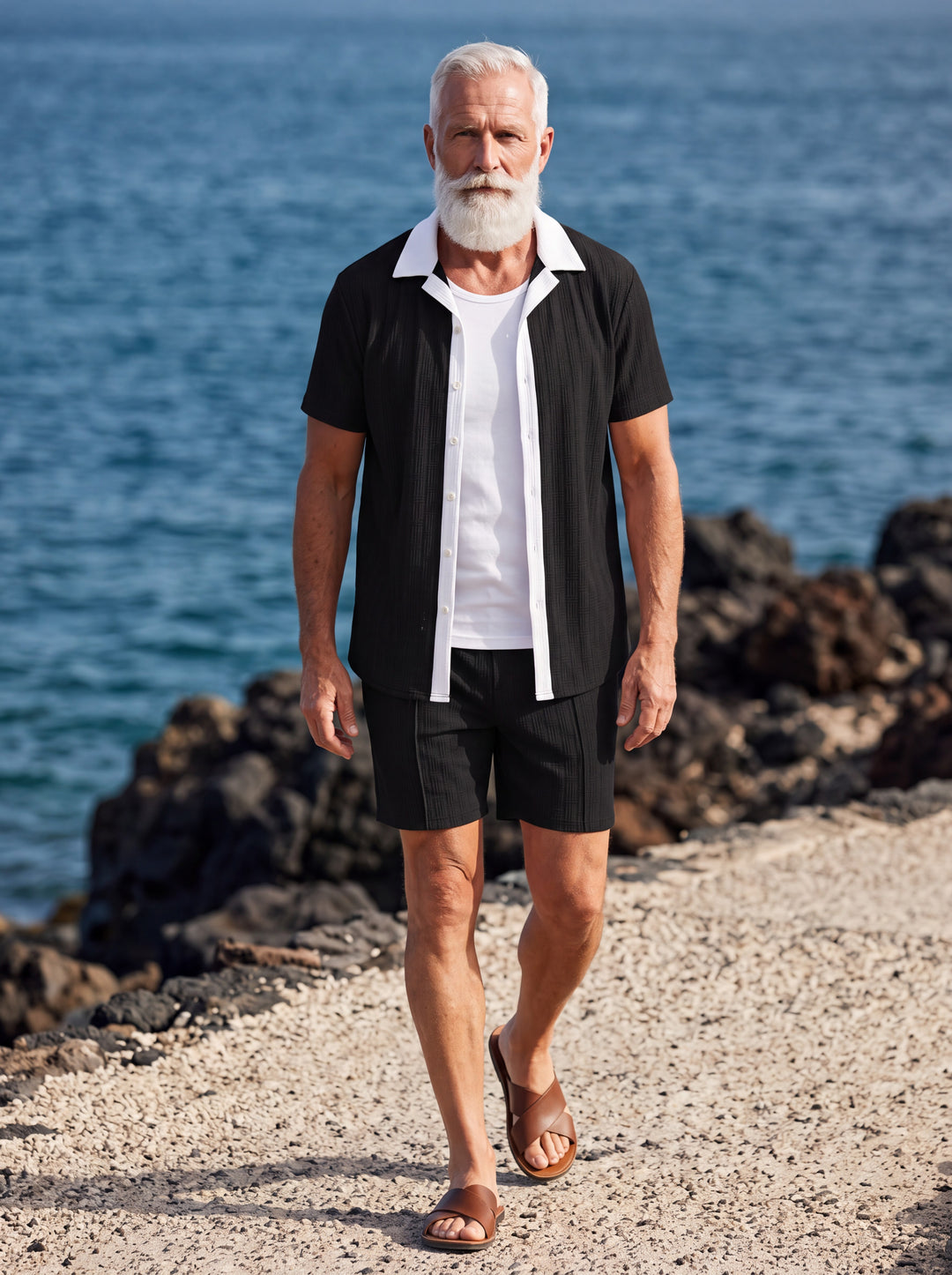 Ethan Men two-piece summer set in black, worn by a model in a Mediterranean setting - Gentlemens Manor lifestyle