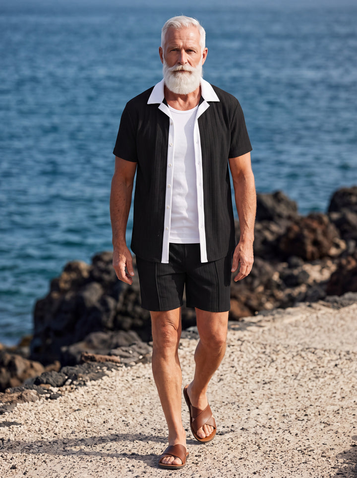 Ethan Men two-piece summer set in black, worn by a model in a Mediterranean setting - Gentlemens Manor lifestyle