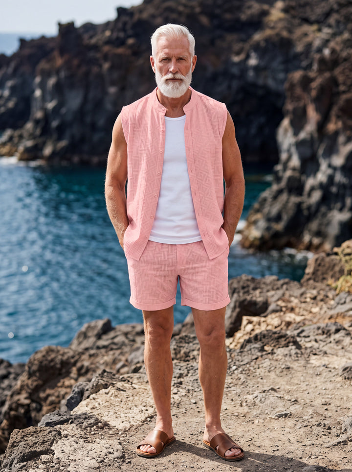 Evan Men two-piece summer set in pink, worn by a model in a Mediterranean setting - Gentlemens Manor lifestyle