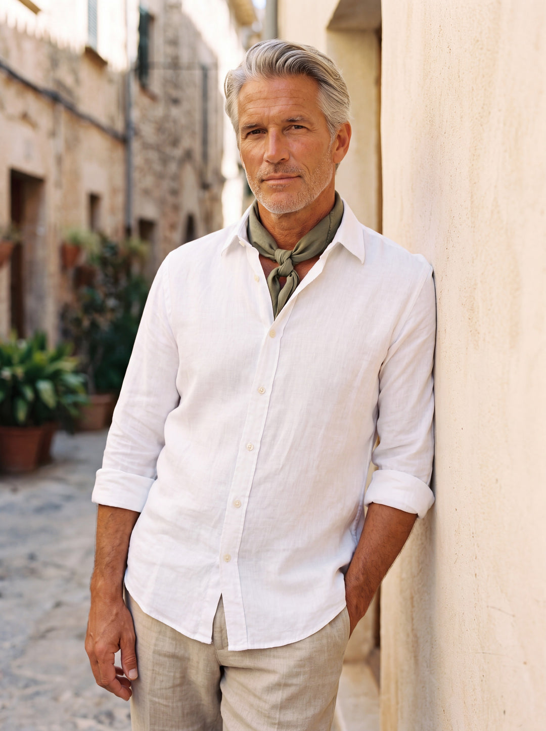 Everett Men linen shirt in white, worn by a model on a Mediterranean terrace - Gentlemens Manor lifestyle