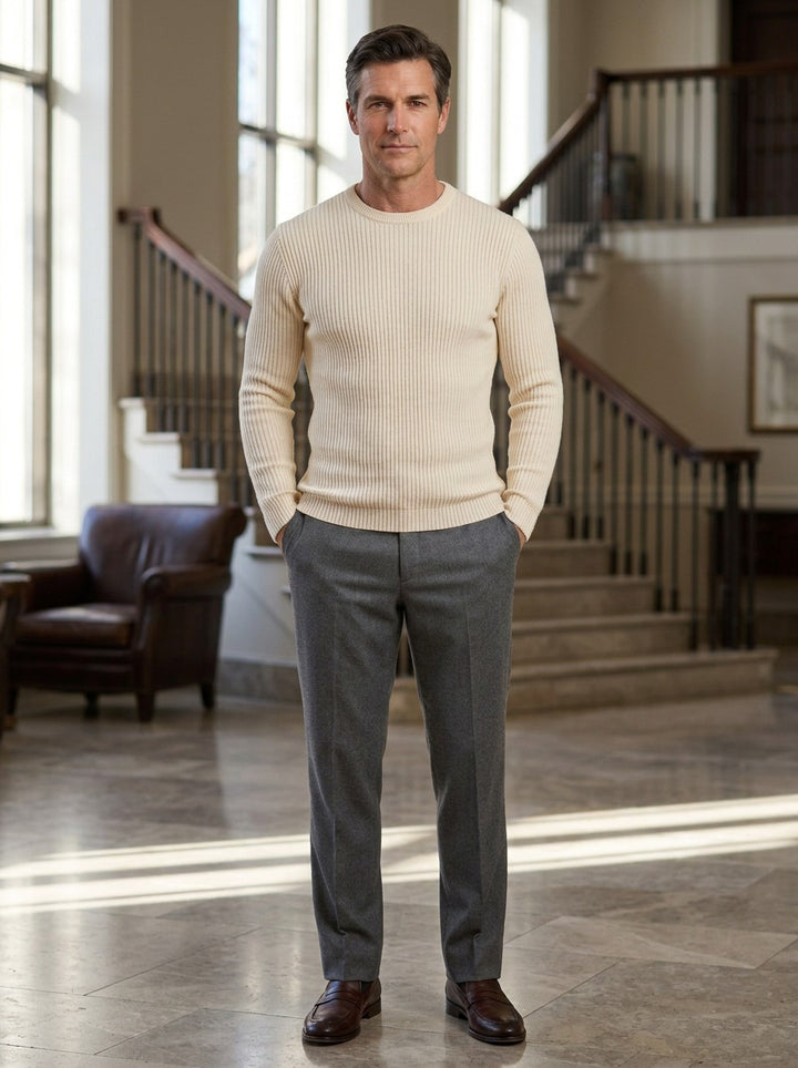 Farrow crew neck sweater in Cream, lifestyle in a hotel lobby, Gentlemens Manor
