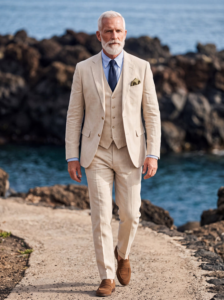 Ferdinand Men three-piece suit in beige, worn by a model in a Mediterranean setting - Gentlemens Manor lifestyle
