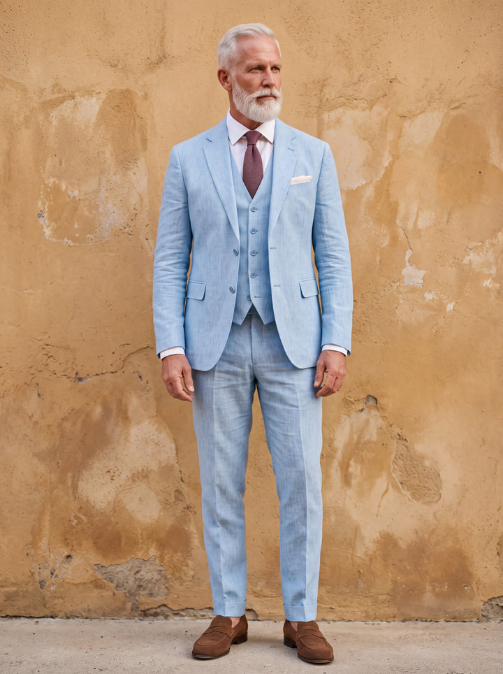 Ferdinand Men three-piece suit in blue, worn by a model in a Mediterranean setting - Gentlemens Manor lifestyle