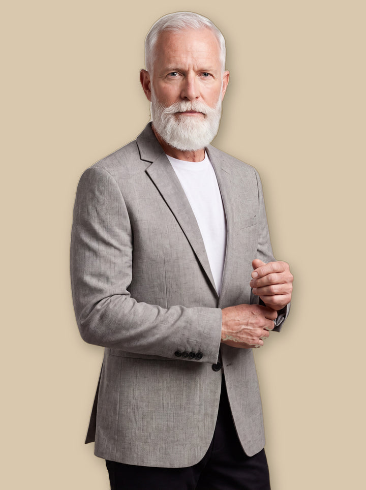 Fielding blazer suit in Grey, worn by a model on a warm sand studio background - Gentlemens Manor