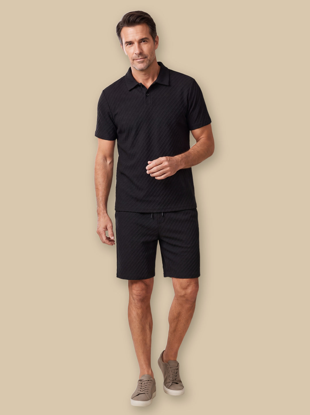 Finley two piece set in Black, worn by a model on a warm sand studio background - Gentlemens Manor