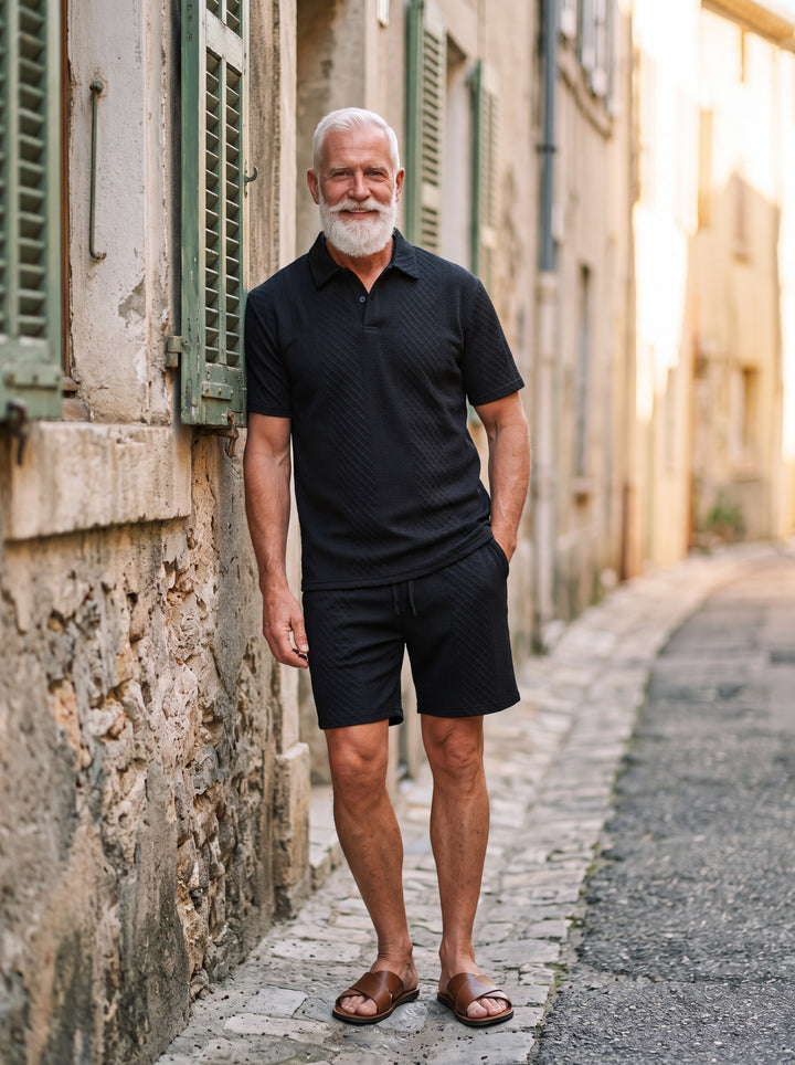 Finley Men two-piece summer set in black, worn by a model in a Mediterranean setting - Gentlemens Manor lifestyle