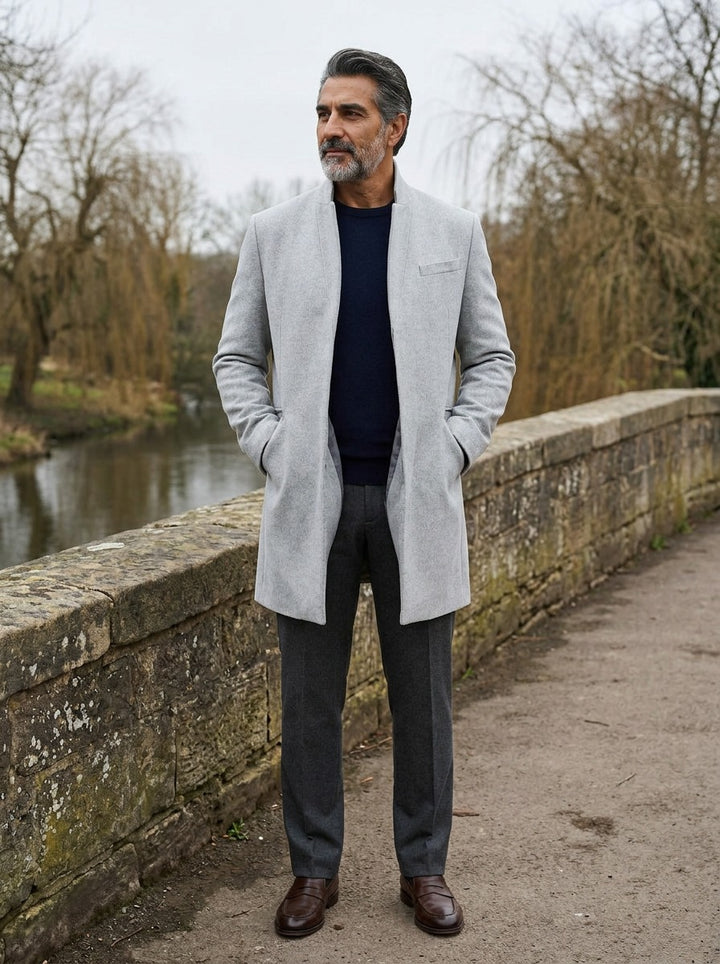 Forrester stand collar overcoat in Grey, lifestyle on a stone footbridge, Gentlemens Manor