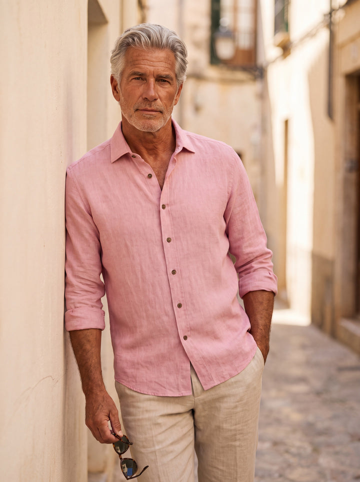 Forsyth Men linen shirt in pink, worn by a model on a Mediterranean terrace - Gentlemens Manor lifestyle