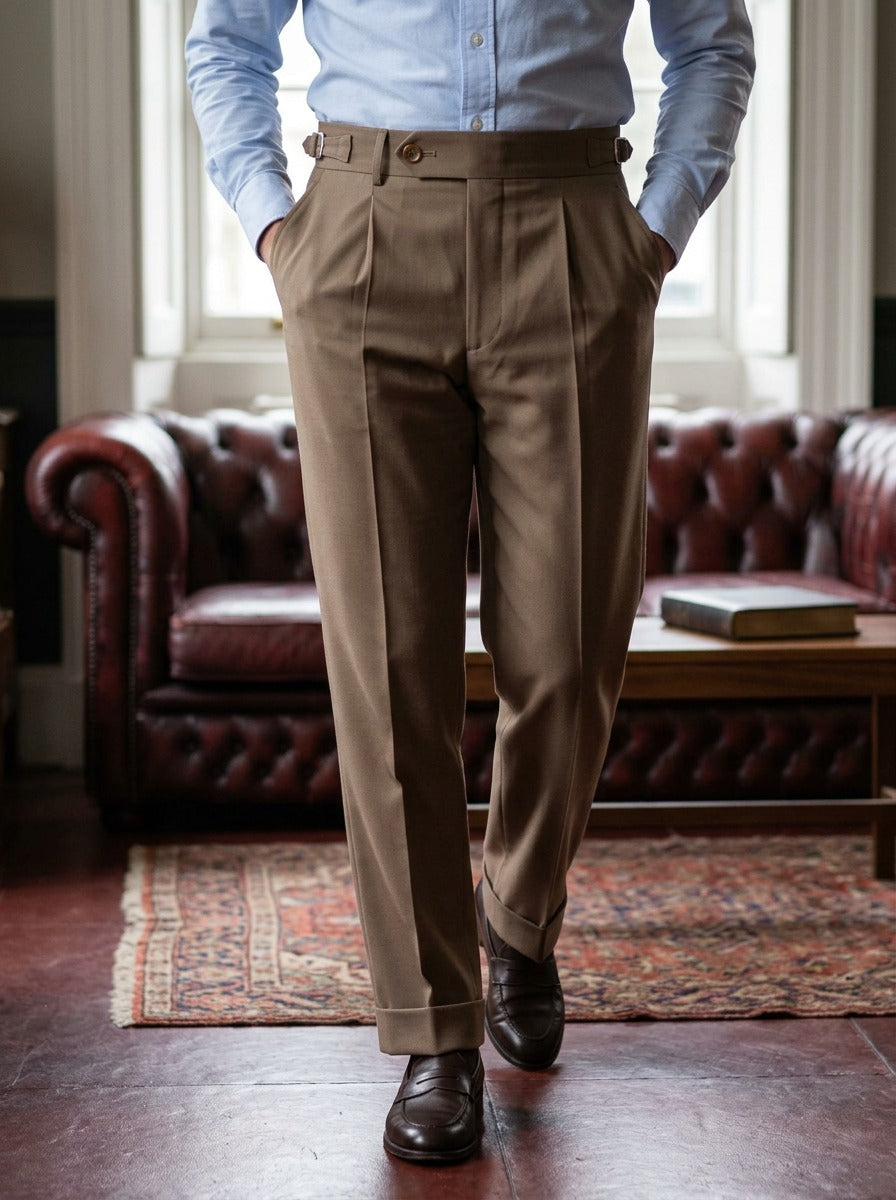 Fowler side adjuster high waist trousers in Brown, lifestyle in a club reading room, Gentlemens Manor