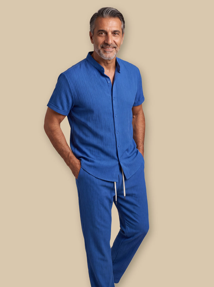 Francis two piece set in Blue, worn by a model on a warm sand studio background - Gentlemens Manor