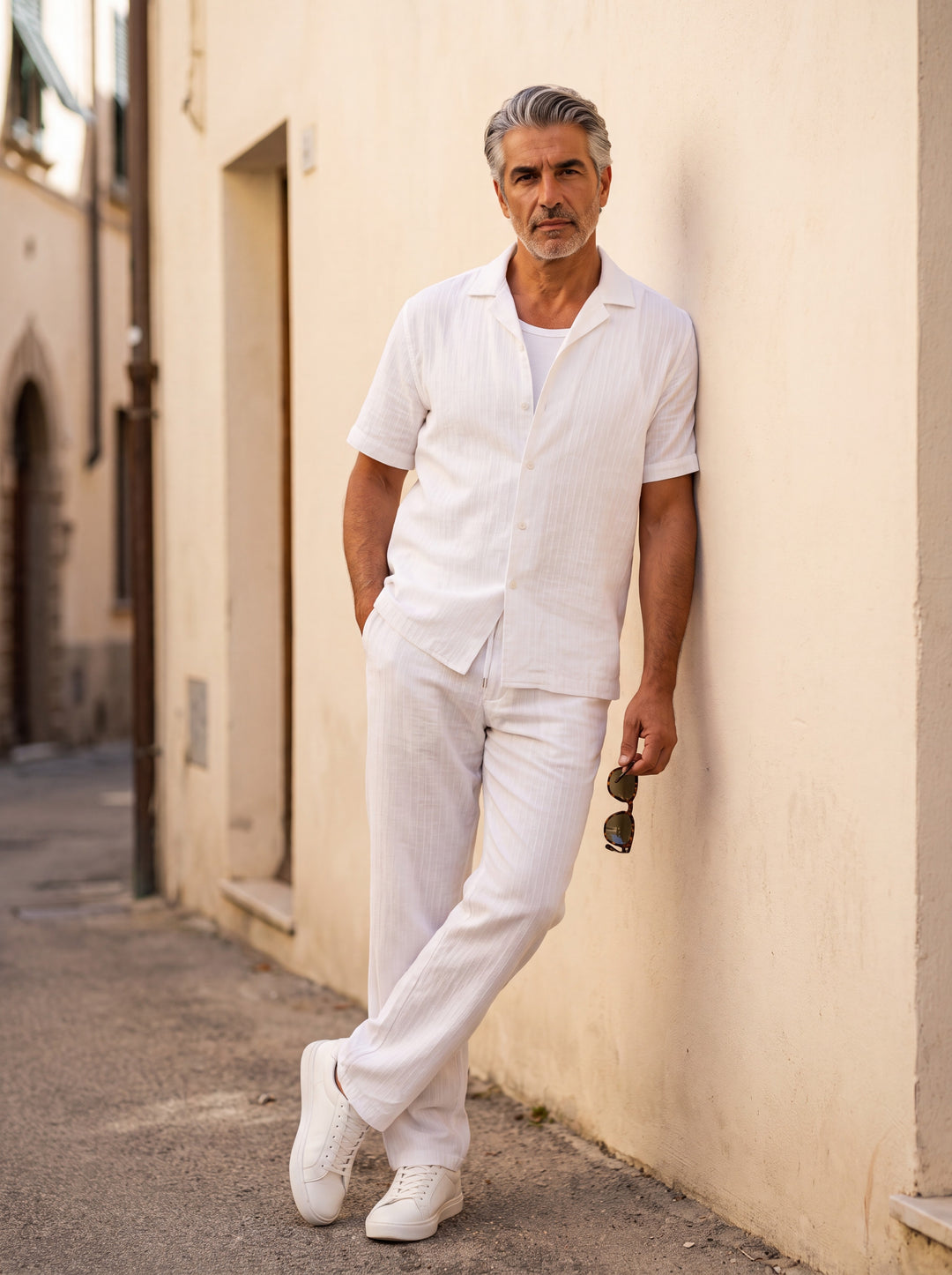 Francis Men two piece set in white, worn by a model on a Mediterranean terrace - Gentlemens Manor lifestyle