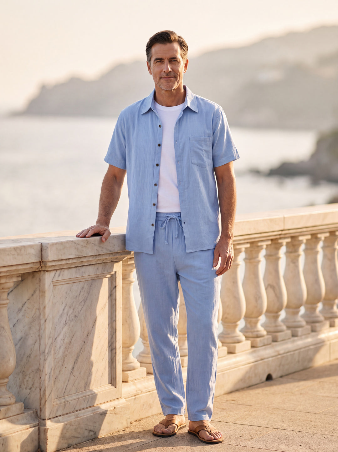 Frederick Men two piece set in light blue, worn by a model on a Mediterranean terrace - Gentlemens Manor lifestyle