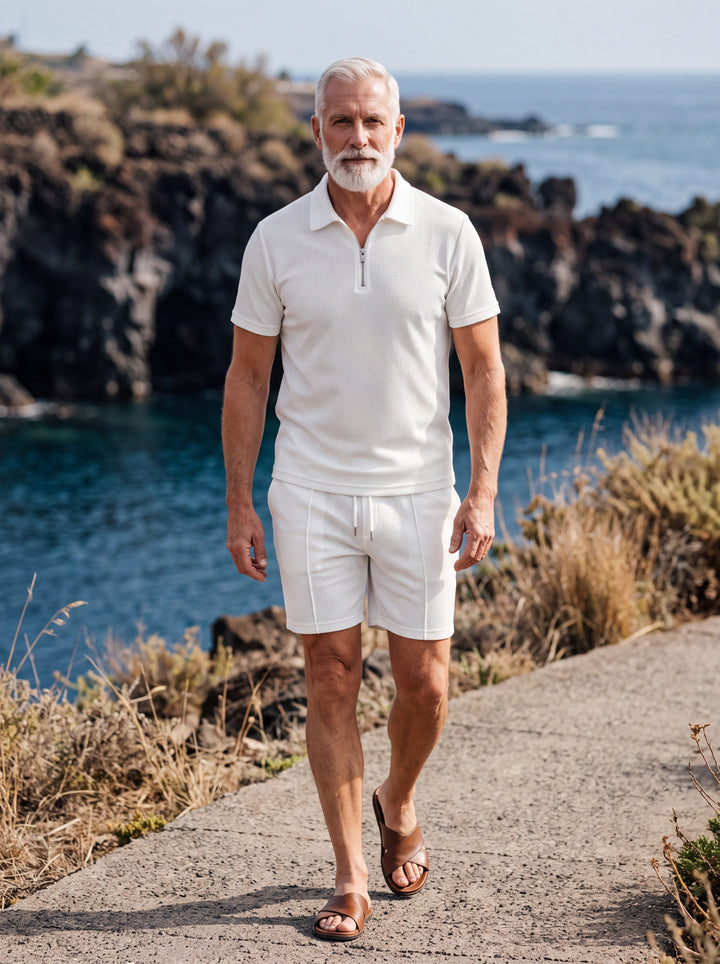 Freeman Men two-piece summer set in white, worn by a model in a Mediterranean setting - Gentlemens Manor lifestyle