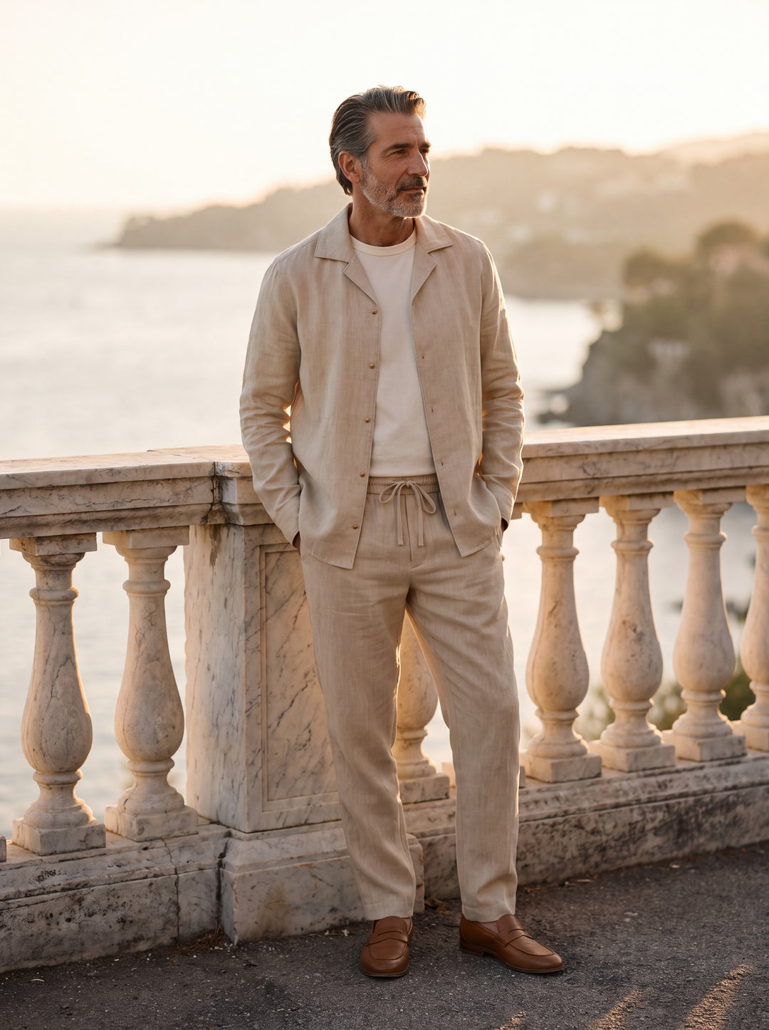 Garland Men two piece set in beige, worn by a model on a Mediterranean terrace - Gentlemens Manor lifestyle