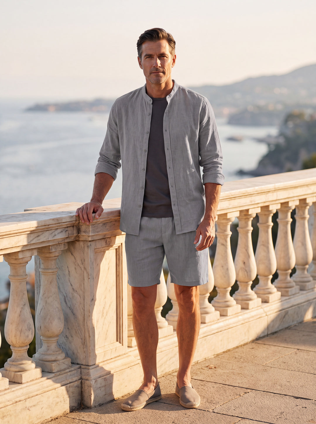 Gene Men two piece set in Grey, worn by a model on a Mediterranean terrace - Gentlemens Manor lifestyle