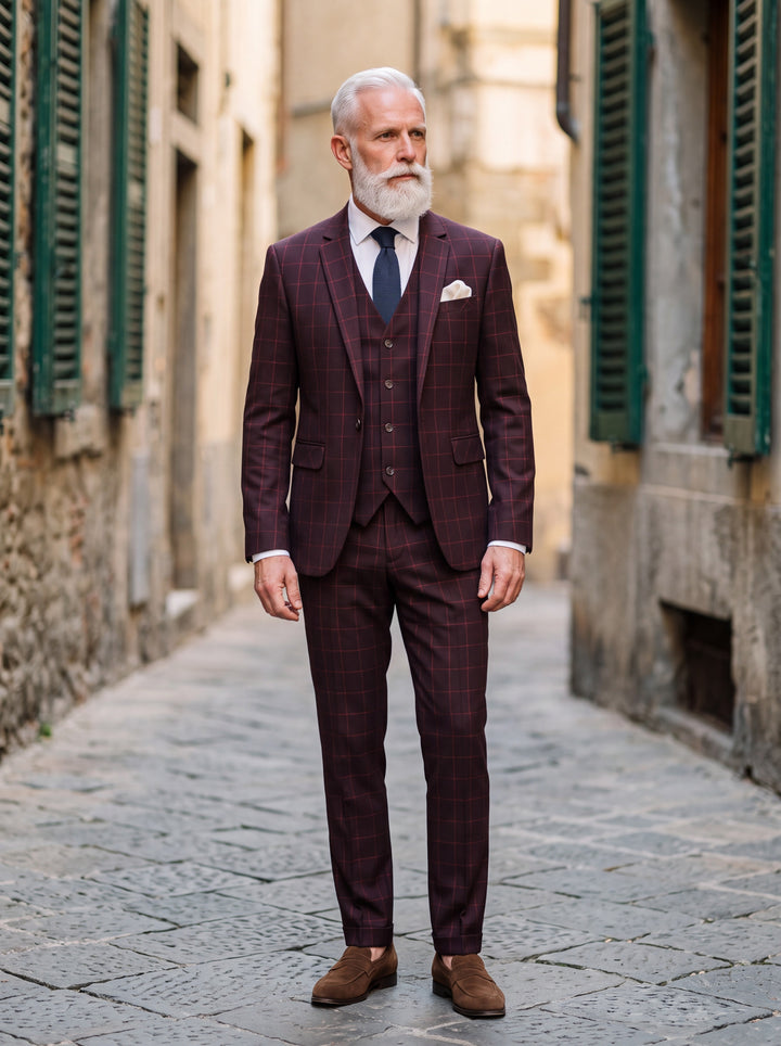 George Men three-piece suit in burgundy, worn by a model in a Mediterranean setting - Gentlemens Manor lifestyle