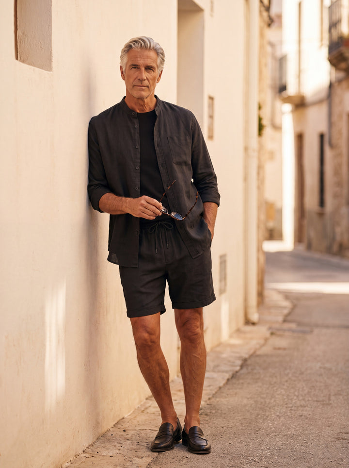 Gilbert Men two piece set in black, worn by a model on a Mediterranean terrace - Gentlemens Manor lifestyle
