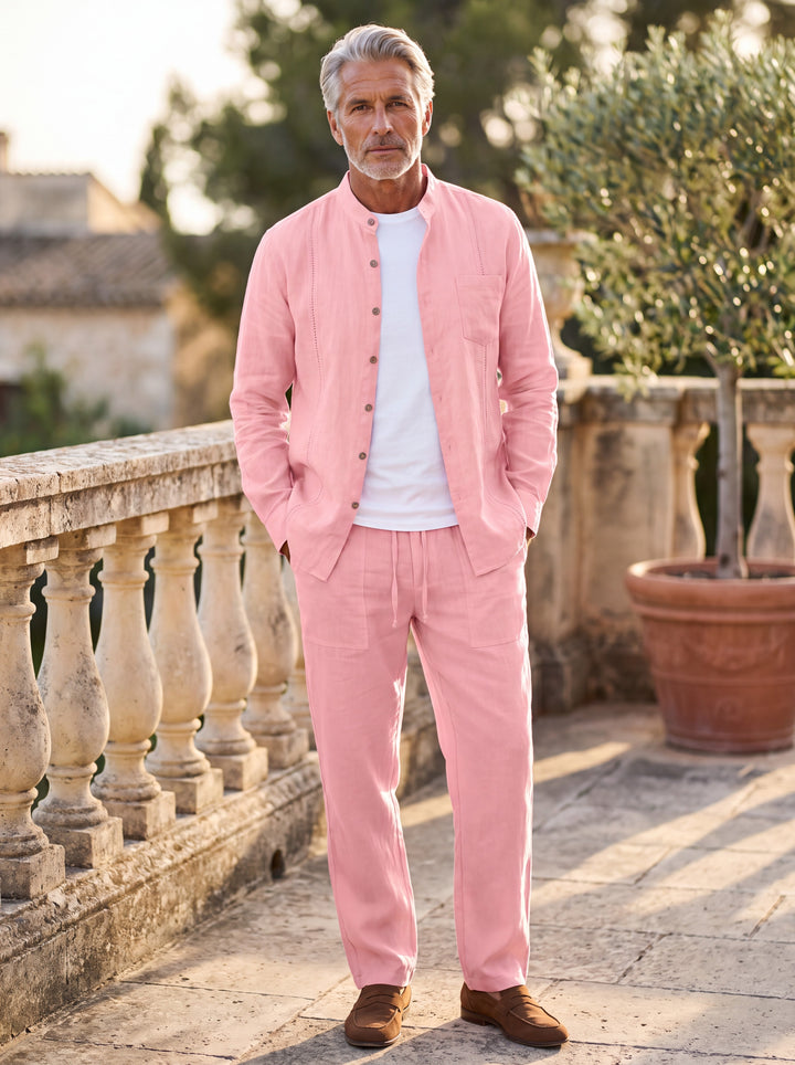 Glenn Men two piece set in pink, worn by a model on a Mediterranean terrace - Gentlemens Manor lifestyle